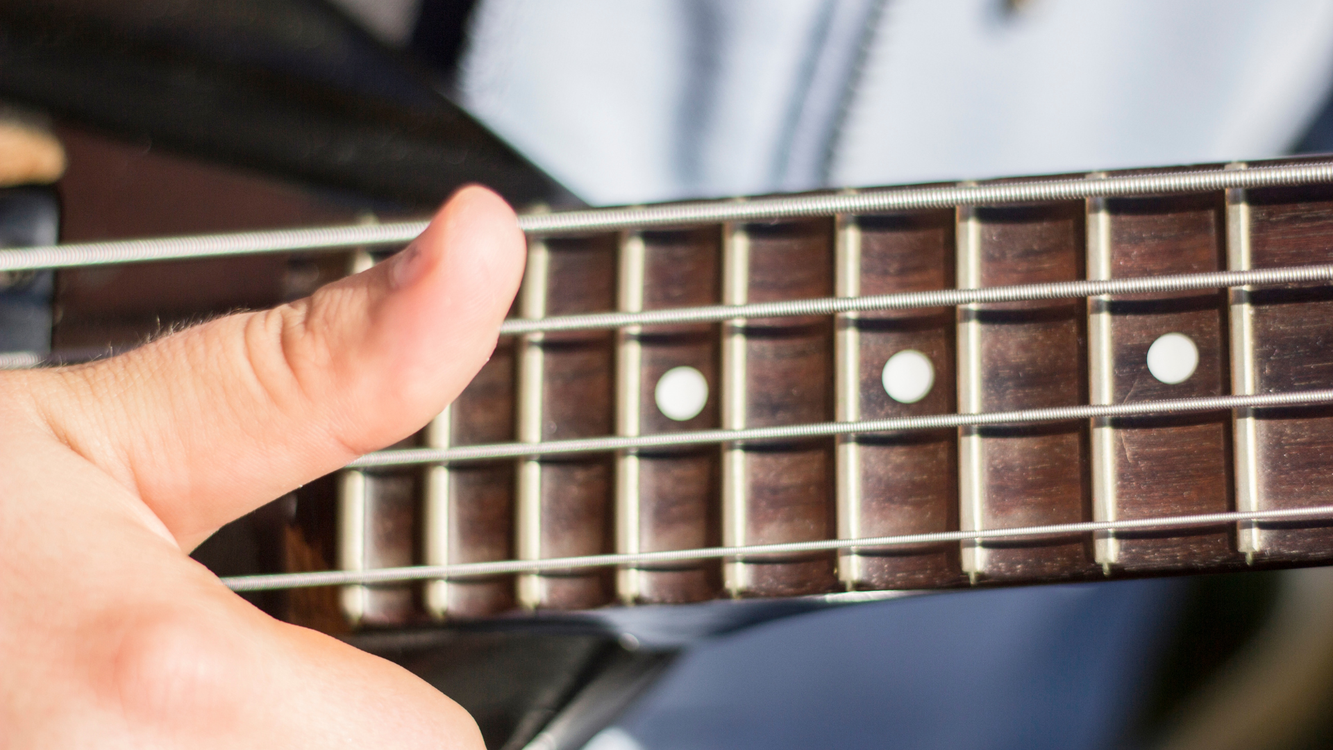 A bass player using advanced slap bass technique