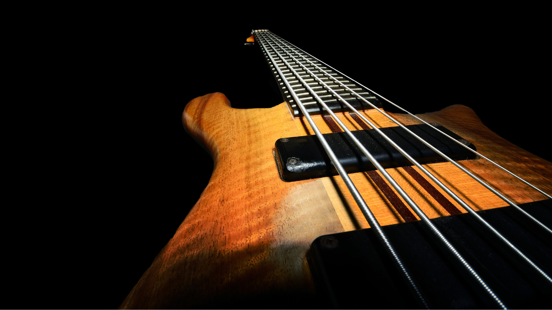 A bass guitar in a dark room