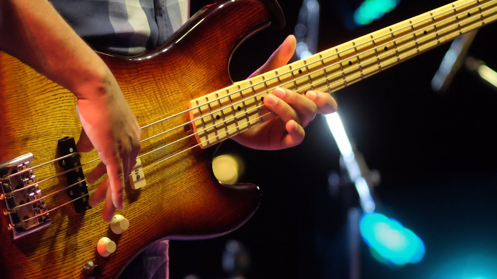 Bass player playing notes higher up the fretboard