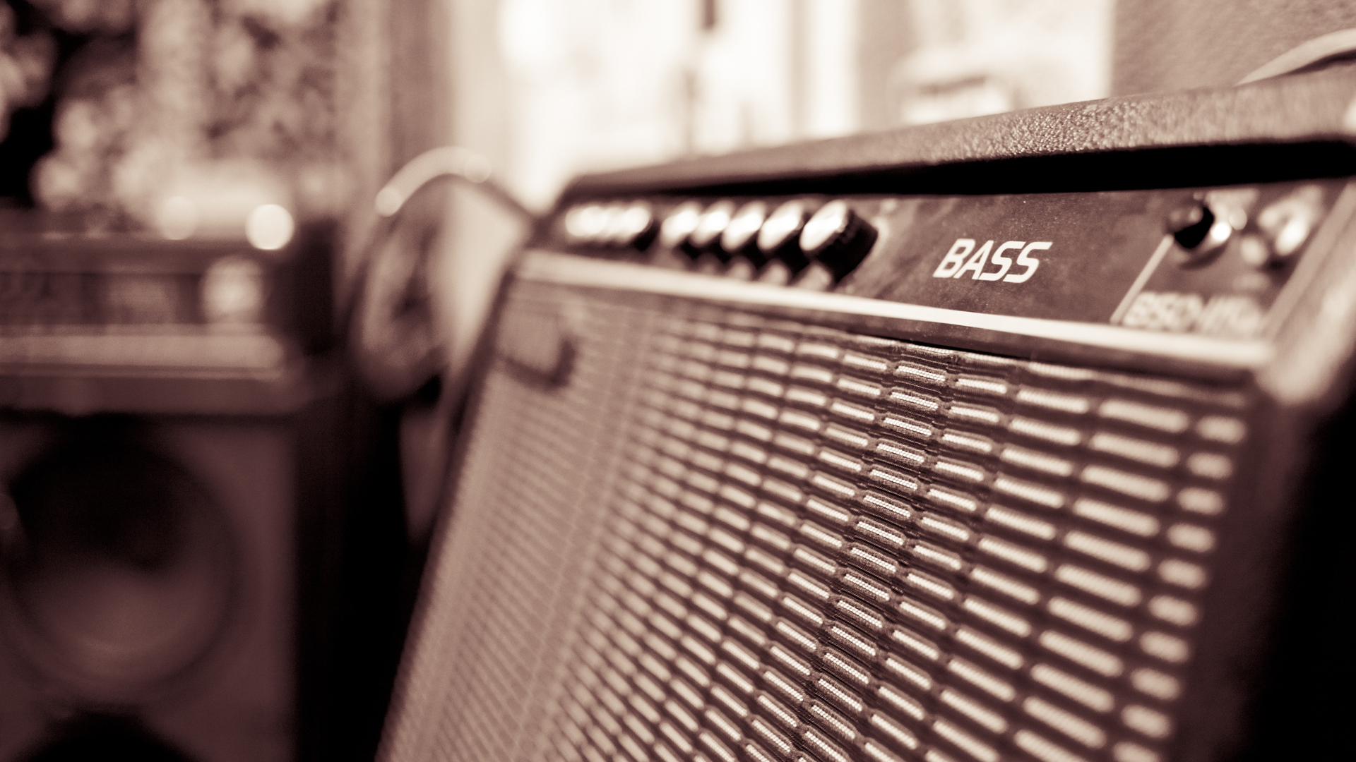 A close up of a bass guitar amp