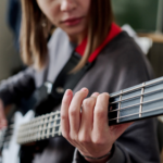 Girl playing a bass guitar