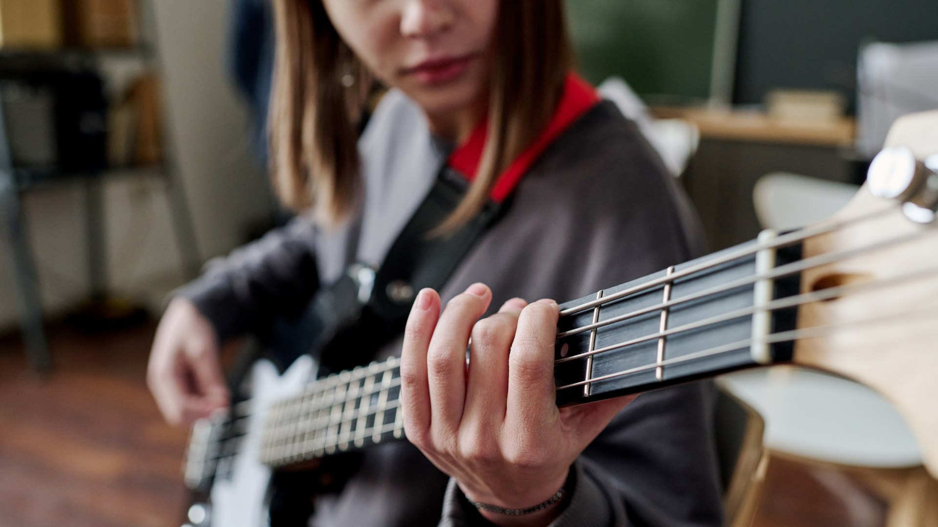 Girl playing a bass guitar