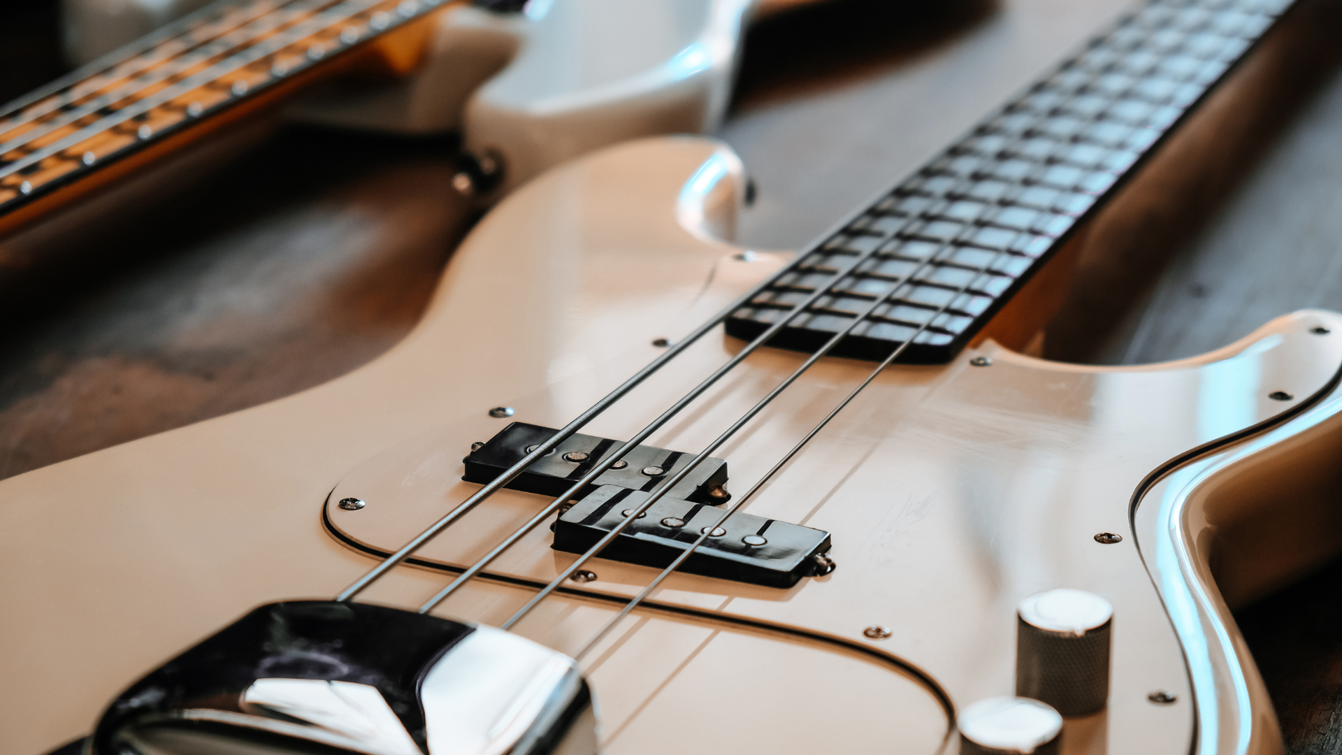 A bass guitar with a bridge cover