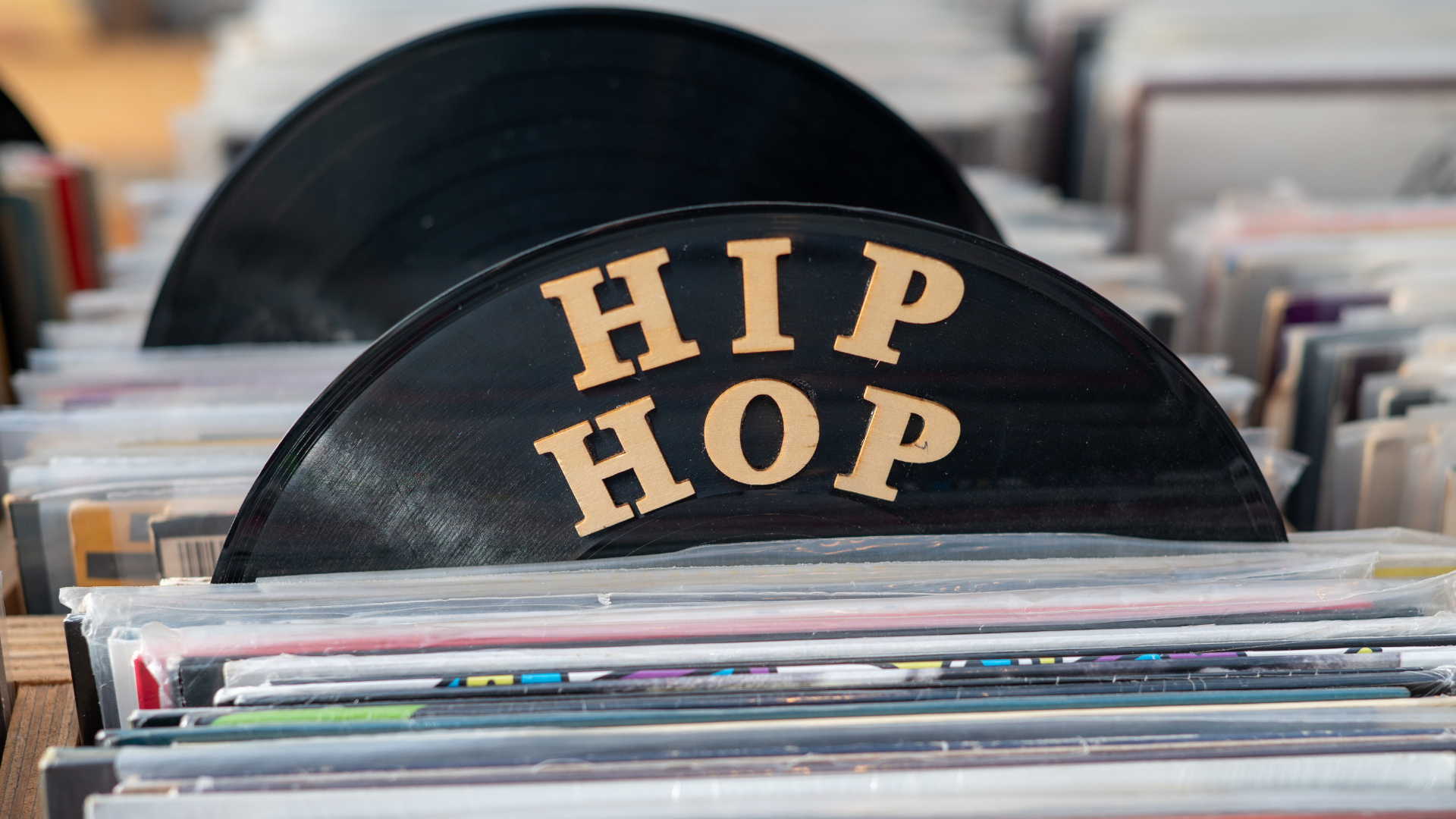 Record shop rack highlighting Hip Hop albums