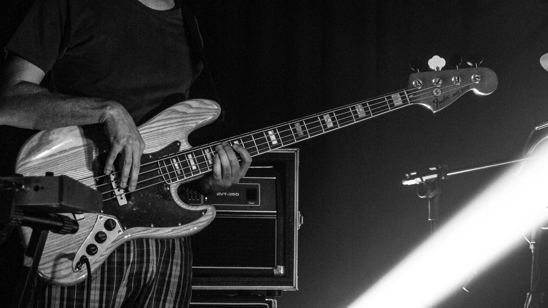 A bass player with a Fender at a Jazz gig