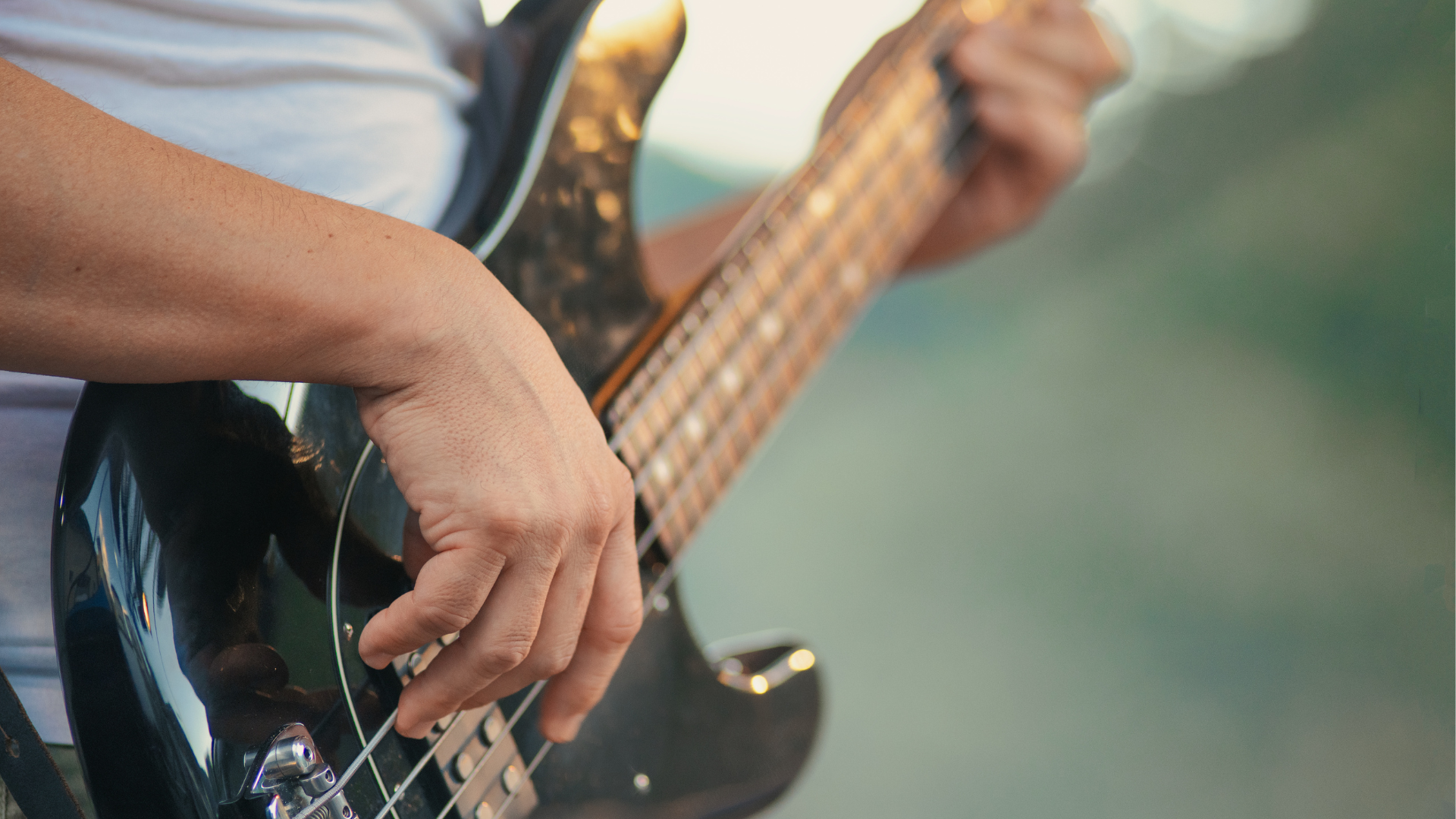 A bass player onstage for a pop band